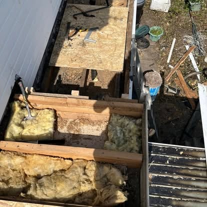 Roof being stripped showing insulation