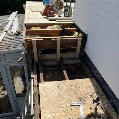 Roof joists exposed during repair