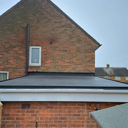 Completed EPDM flat roof with new white fascia boards