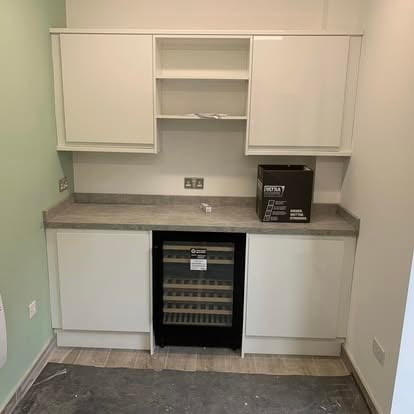 Built-in white kitchen with wine cooler