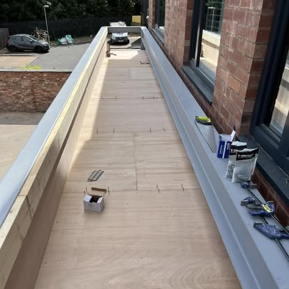 Flat roof plywood boarding large building