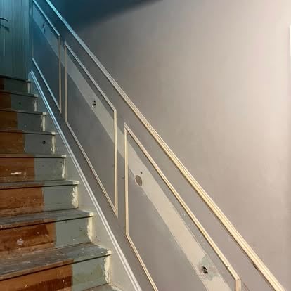 Staircase wall panelling being installed