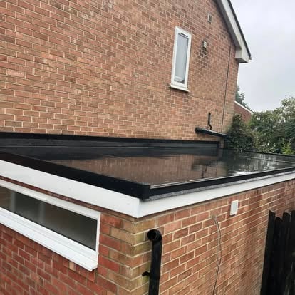 Completed EPDM flat roof on brick extension