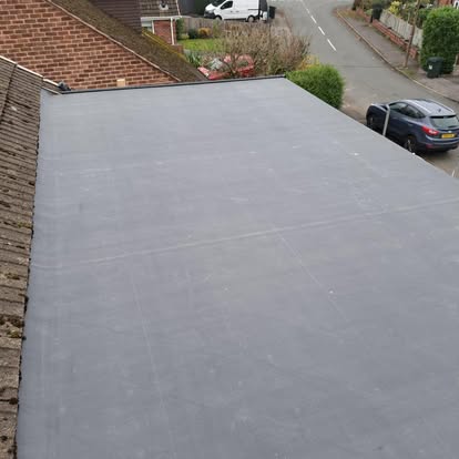 Large EPDM flat roof aerial view residential