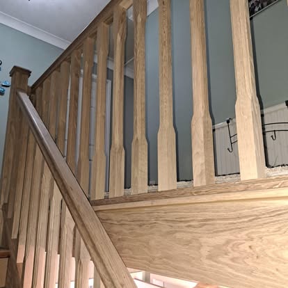 Oak staircase banister sage green walls