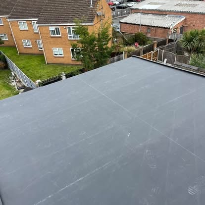 Large EPDM flat roof aerial urban setting
