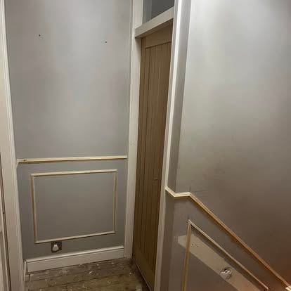 Hallway oak door and wall panelling