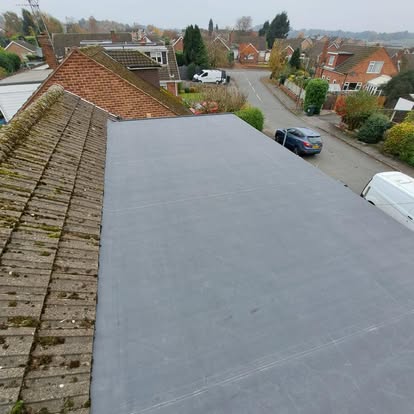 Large EPDM flat roof aerial suburban view