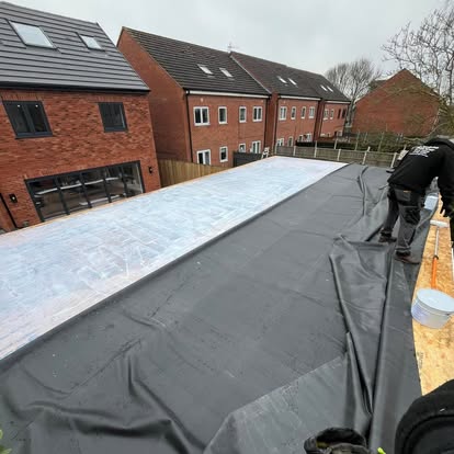 EPDM membrane being laid large new development