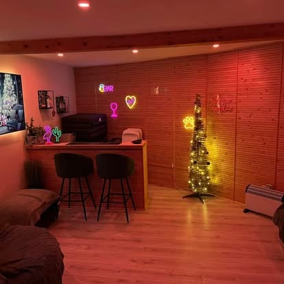 Garden room interior bar area with neon signs