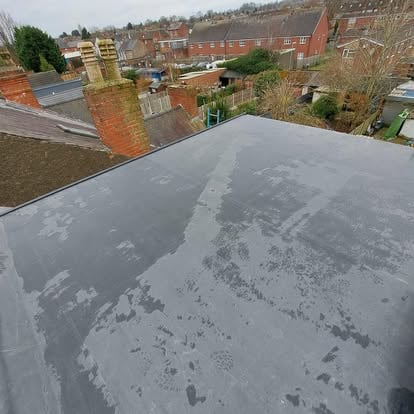 Completed EPDM flat roof urban terrace chimneys