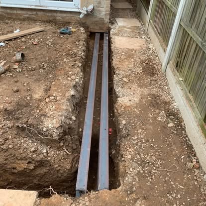 Foundation trench excavated with RSJ steel beams laid