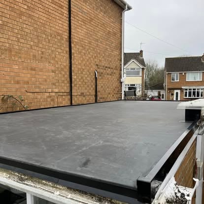 Completed EPDM flat roof on brick garage outbuilding