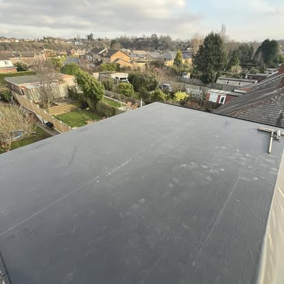 Large completed EPDM flat roof panoramic suburban view