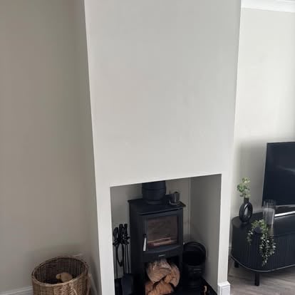 Completed alcove fireplace with wood burning stove fitted