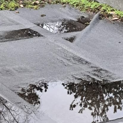 Badly damaged flat roof with splitting felt
