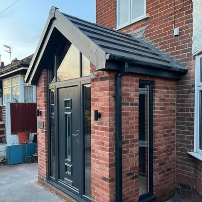 Brick entrance porch with dark grey glazed canopy
