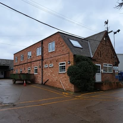 Commercial brick building exterior for roofing work
