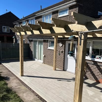 Completed composite decking with large timber pergola