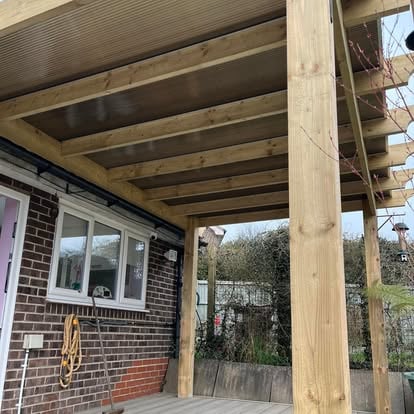 Covered verandah with profiled metal roof on timber frame