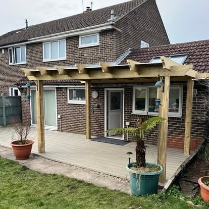 Completed composite decking with large timber pergola