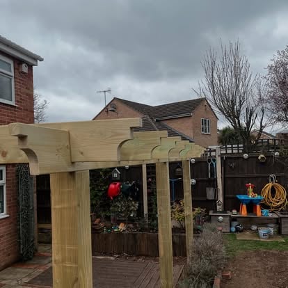 Brick house with polycarbonate roof panels on timber pergola