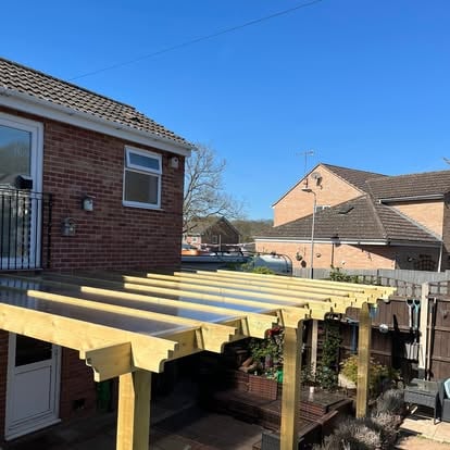Wide view of timber pergola with polycarbonate roofing
