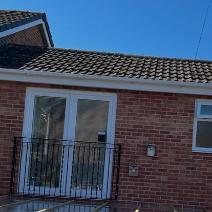 House with Juliet balcony before covered pergola build