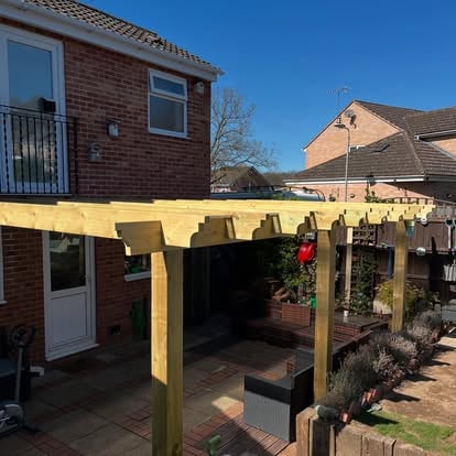 Completed covered timber pergola with polycarbonate roof