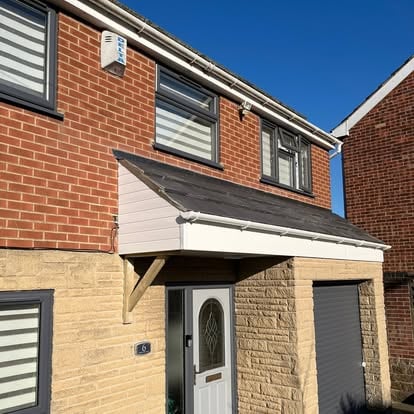 House 6 with old dark timber porch canopy front view