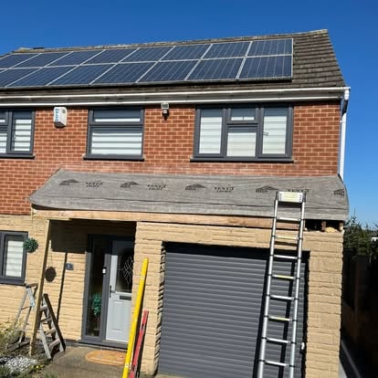 Solar panel house during roofline work with ladders