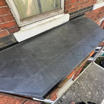 Old bay window roof stripped with hole in rotten substrate