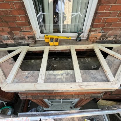 New timber frame with joists on Victorian bay window roof
