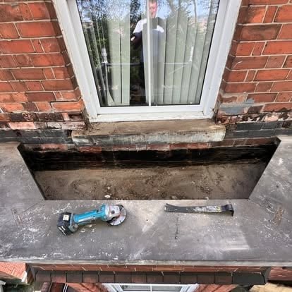 Victorian bay window old felt being stripped with tools