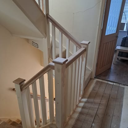 New staircase with square spindles and oak handrail