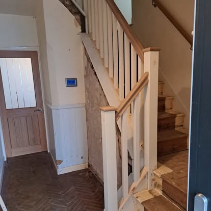 Staircase installation with herringbone floor entry