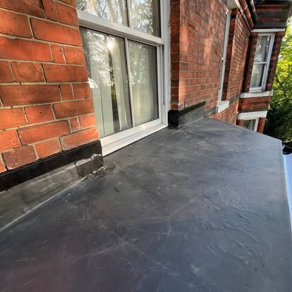 EPDM flat roof on Victorian house with bifold doors