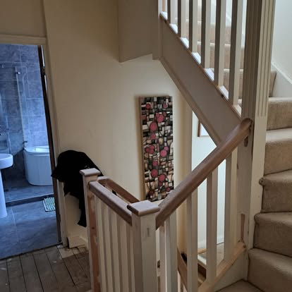 Square spindle staircase with oak handrail
