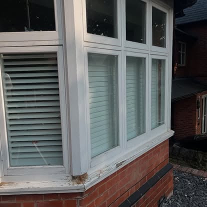 Old UPVC bay window exterior before replacement