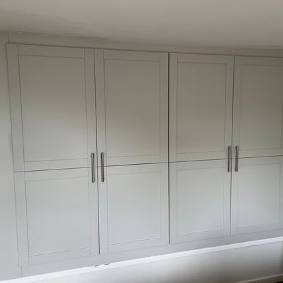 Built-in white shaker fitted wardrobes