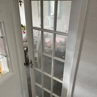 White glazed 15-light internal door installed