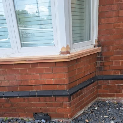 New timber cill being fitted to bay window corner