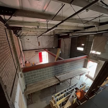 Large commercial space with exposed RSJ steel beam