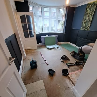 Bay window room with floor being stripped