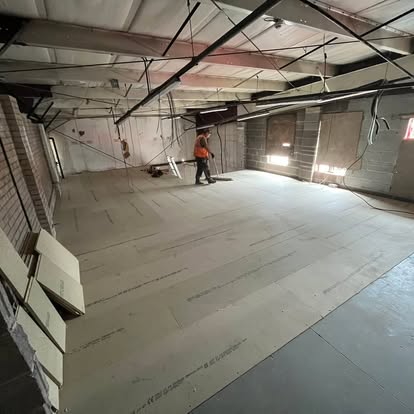 Commercial space with new floor insulation being laid