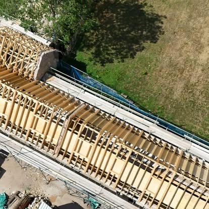 Aerial view of new timber rafters on historic building