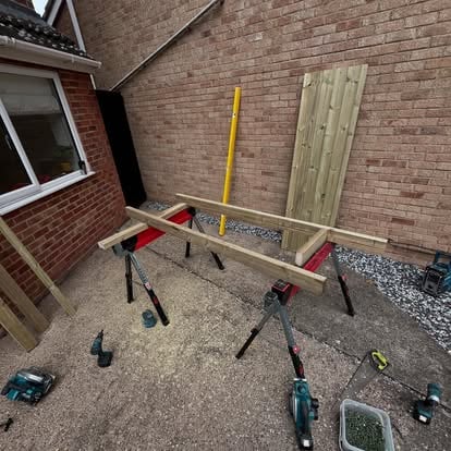 Timber gate components being assembled on sawhorses