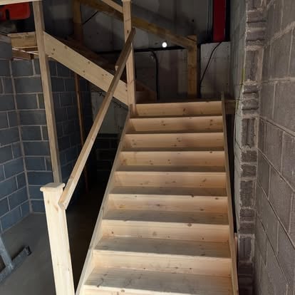 New pine staircase installed in blockwork building