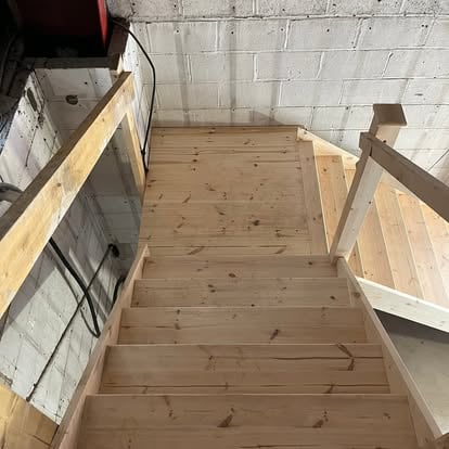 New pine timber staircase in blockwork building