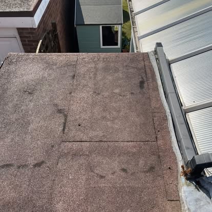 Old deteriorating felt flat roof before replacement